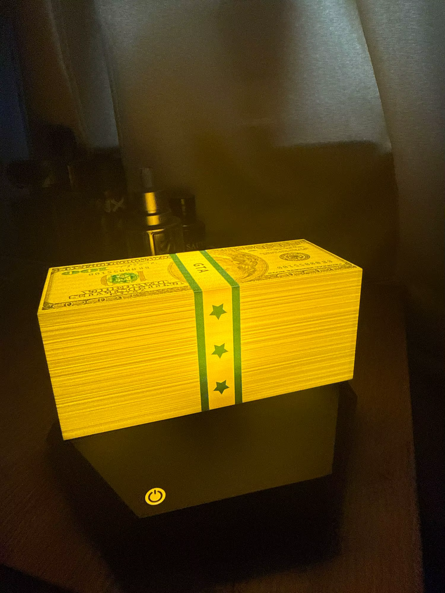 Customer photo 2 of the Wasted Lamp levitating cash lamp on a desk