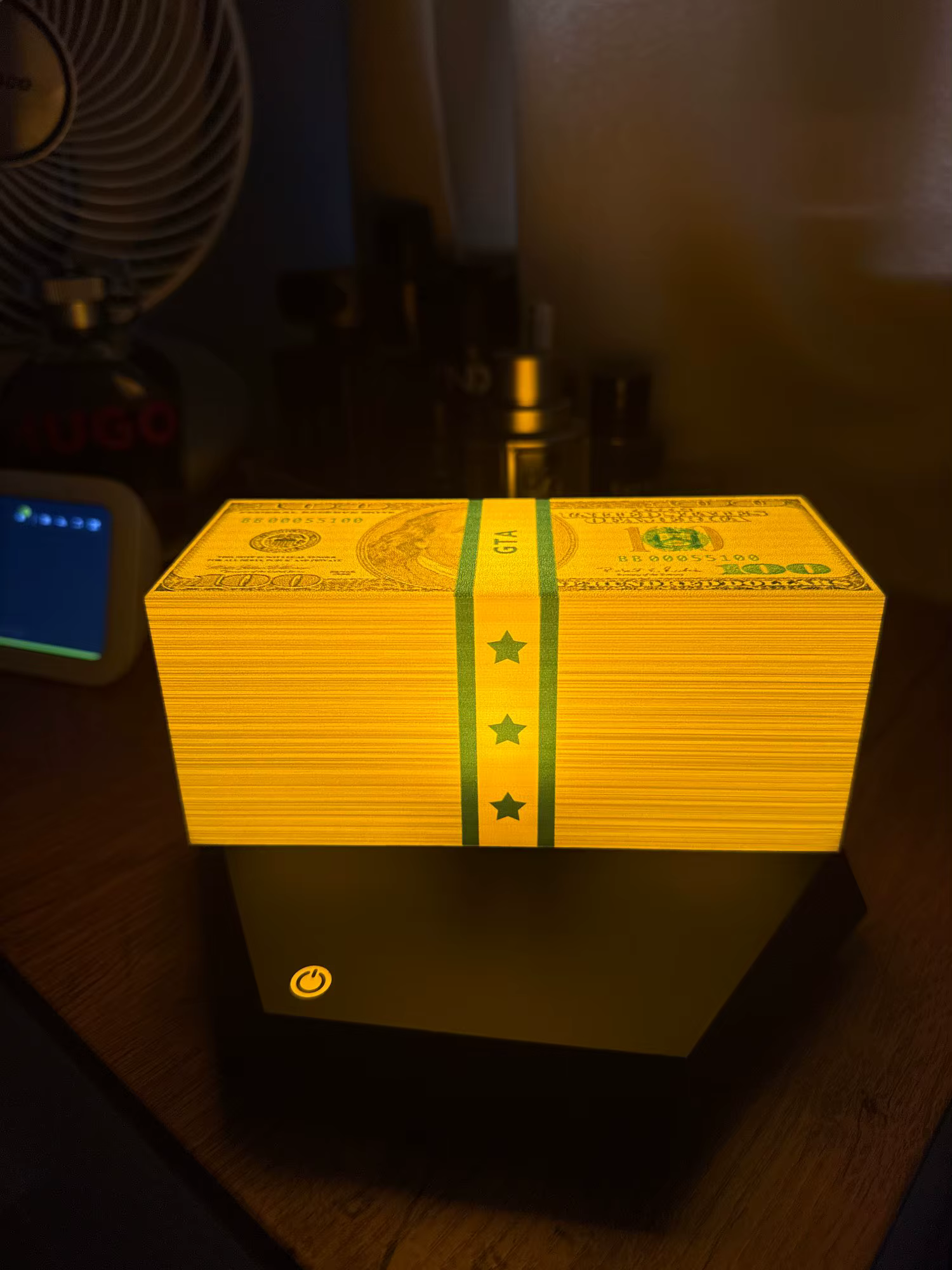 Customer photo 1 of the Wasted Lamp levitating cash lamp on a desk